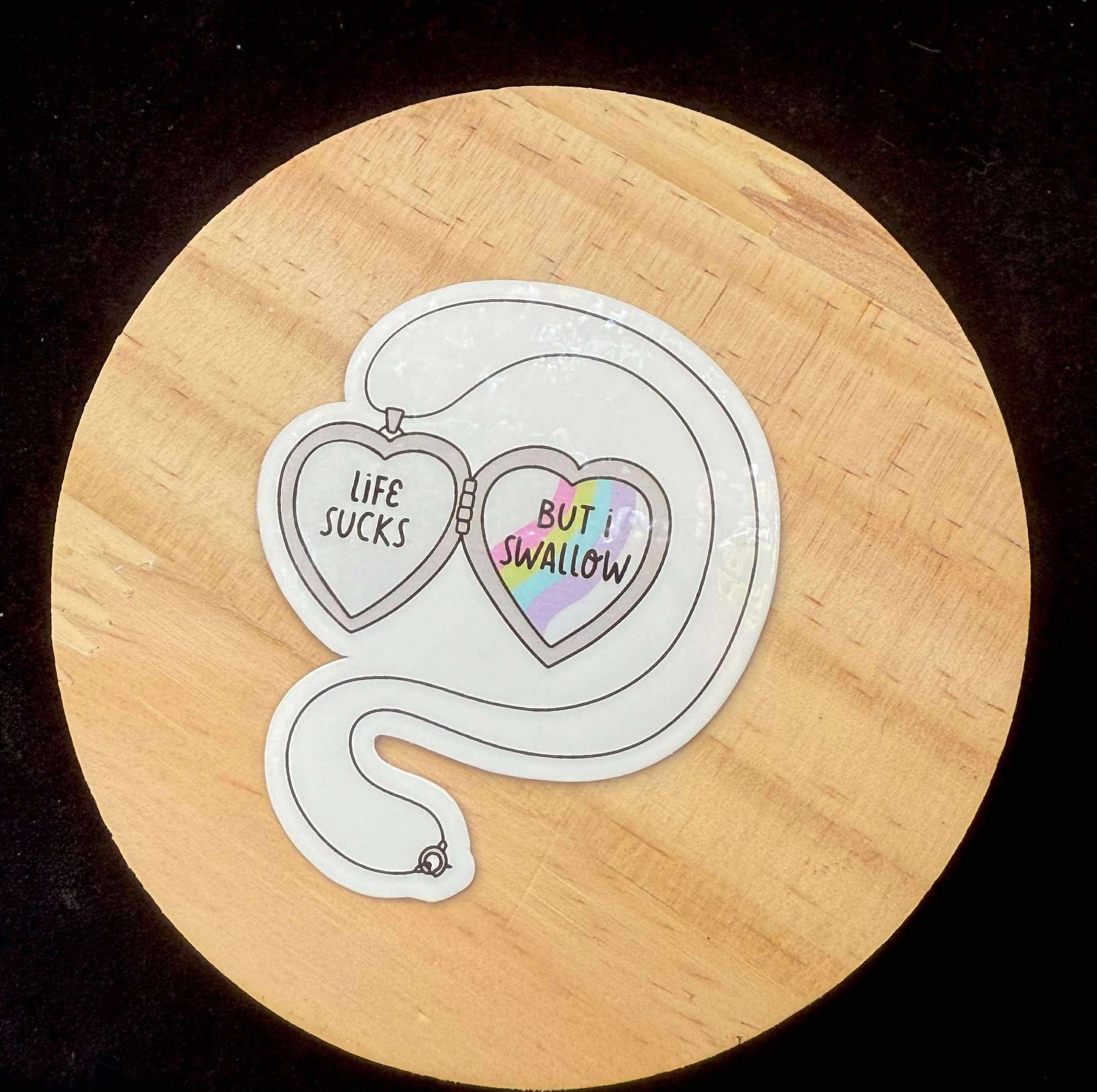 “Life Sucks but I Swallow” Locket Sticker – Spicy Snarky Holographic Decal